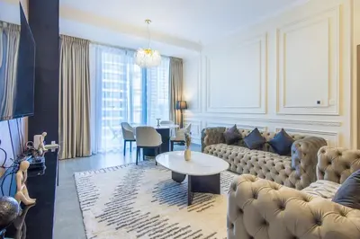 a living room with a couch and a table at Stella Maris, Dubai Marina- Luxurious 1-BR in Dubai