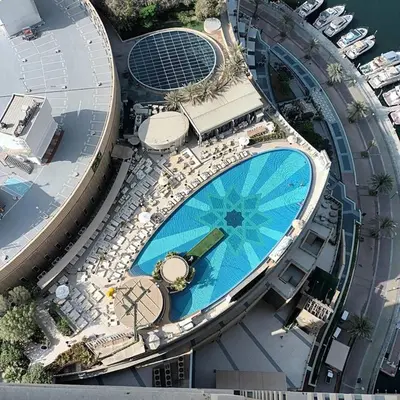 an overhead view of a swimming pool on top of a building at HAVN - Studio Dubai Marina View in Dubai