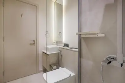 a bathroom with a toilet and a sink and a mirror at Mag Eye Townhouse - 2BR & M Room Townhouse - Allsopp & Allsopp in Dubai