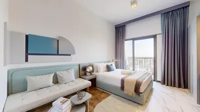 a hotel room with a bed and a couch at Mag Eye 920 - Classy Studio Apartment in Meydan in Dubai