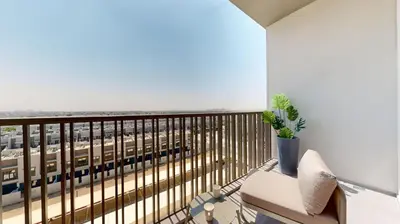 a balcony with a view of a train at Mag Eye 910 - Peaceful Studio Apartment in Meydan in Dubai