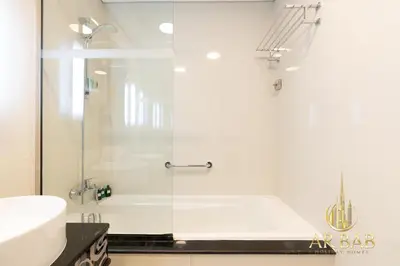 a bathroom with a shower and a sink at Damac Maison Mall Street - Royal 3BR - Burj Khalifa View - Near Dubai Mall in Dubai