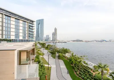 a building with a view of a body of water at Luxurious 2 Bed in Bluewaters, Hosted by Desert City Stays in Dubai