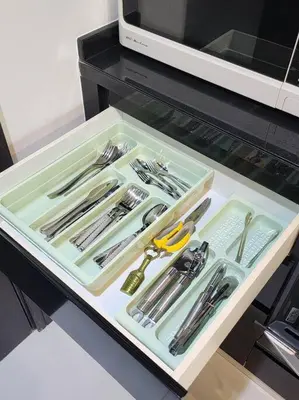 a tray filled with utensils on a table at Studio with Terrace Damac Maison Cour Jardin Business Bay in Dubai
