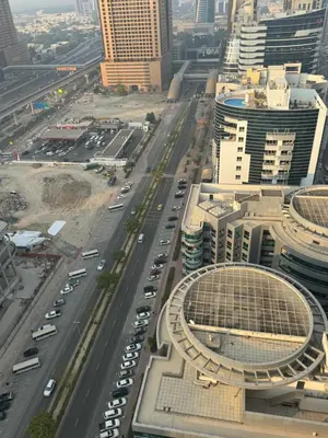 an aerial view of a busy city street with cars at Loft bed short and long stay in Dubai