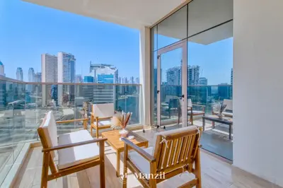 a dining room with a view of the city at 2BR Apt in Business Bay with Iconic Burj Khalifa and Dubai Canal Views in Dubai
