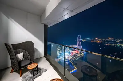 a balcony with a view of the city at night at Address JBR, Beach View, Jumeirah Beach Residence - Mint Stay in Dubai