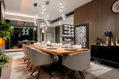 a dining room with a wooden table and chairs at Address JBR, Beach View, Jumeirah Beach Residence - Mint Stay in Dubai