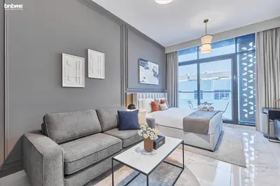 a living room with a couch and a bed at bnbmehomes - Serenity Lakes 5 in Dubai