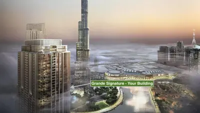an aerial view of a city with a skyscraper at Grande Signature by Emaar! Best Full Burj Khalifa, Fountains, Park View! in Dubai