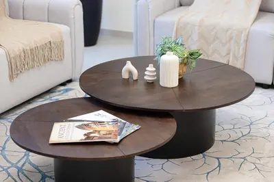 a coffee table in a living room with two chairs at Grande Signature by Emaar! Best Full Burj Khalifa, Fountains, Park View! in Dubai