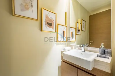 a bathroom with a sink and a mirror at Radiant 2BR with Assistant Room at Citywalk Residential Building 7, Al Wasl by Deluxe Holiday Homes in Dubai