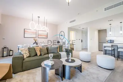a living room with a couch and a table at Luxurious 2BR Apartment at Sadaf 6, Jumeirah Beach Residence by Deluxe Holiday Homes in Dubai