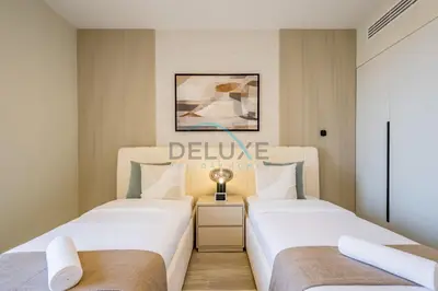 two beds in a small room with at Luxurious 2BR Apartment at Sadaf 6, Jumeirah Beach Residence by Deluxe Holiday Homes in Dubai
