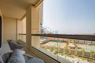 a balcony with a view of a stadium at Luxurious 2BR Apartment at Sadaf 6, Jumeirah Beach Residence by Deluxe Holiday Homes in Dubai