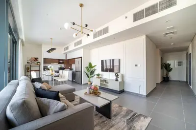 a living room with a couch and a table at Frank Porter - Creek Edge Tower 1 in Dubai