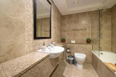 a bathroom with a sink and a toilet at LUXE | 1BR | Heart of DIFC & Trade Centre in Dubai