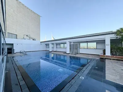 a swimming pool in the middle of a building at LUXE | 1BR | Heart of DIFC & Trade Centre in Dubai