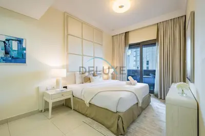 a white bedroom with a large bed and a window at Whimsical 3BR at The Signature, Downtown Dubai by Deluxe Holiday Homes in Dubai