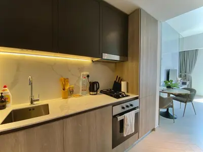 a kitchen with a sink and a stove at Trendy Studio with top Amenities in Dubai