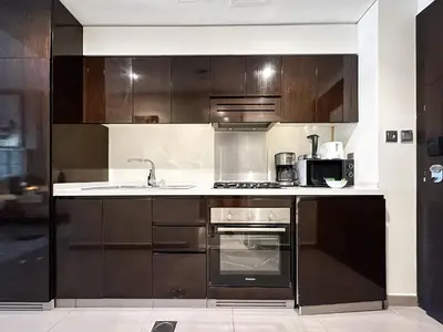 a kitchen with a sink and a stove at Trophy Stays - Supreme Opulence - Chic Studio in Business Bay in Dubai