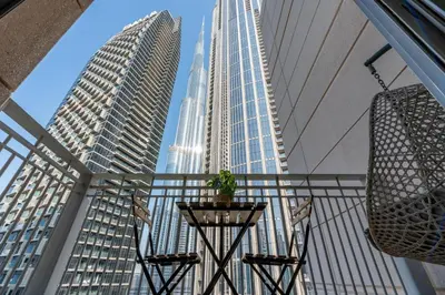 a view of the city from the balcony of a skyscraper at Burj Khalifa Views - 5 min walk from Dubai Mall - Upgraded - Designer Choice - 8 people - Dubai Opera in Dubai