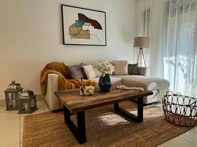 a living room with a couch and a coffee table at Luxurious 1BR Aprt Burj Khalifa Area in Dubai