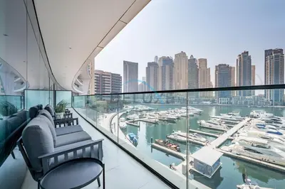 a balcony with a view of a marina at Modern 2BR in VIDA Residences Dubai Marina by Deluxe Holiday Homes in Dubai
