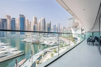 a balcony with a view of a marina at Modern 2BR in VIDA Residences Dubai Marina by Deluxe Holiday Homes in Dubai