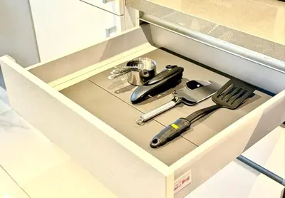 a drawer with a knife and utensils in it at kinda Holiday Homes- Mag 318 Downtown in Dubai