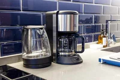a blender sitting on a counter in a kitchen at kinda Holiday Homes- Mag 318 Downtown in Dubai