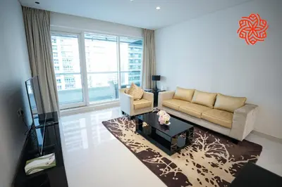 a living room with a couch and a table at Alashrafia Saray- Upscale 1bdr apartment in Canal Views in Dubai