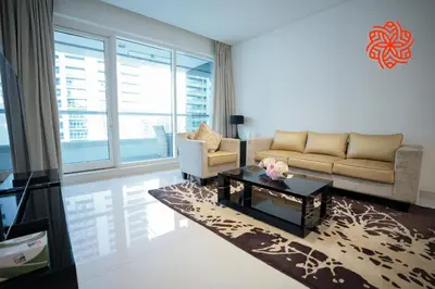 a living room with a couch and a coffee table at Alashrafia Saray- Upscale 1bdr apartment in Canal Views in Dubai