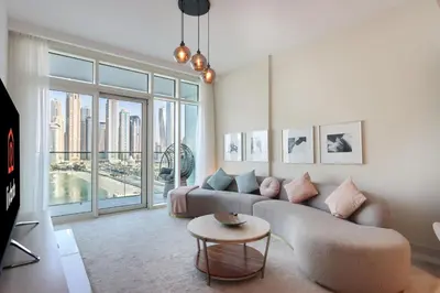 a living room with a couch and a table at 2BR Beachfront Living, Stunning Marina Views in Dubai
