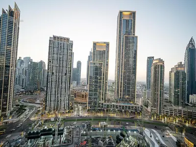 a city with tall skyscrapers in a city at Luxury Home with City Views Near Dubai Mall 196GR-1 in Dubai