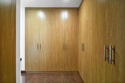 a row of wooden lockers in a room at DAYF-ALI City's Heart Chic 1 BR Huge Terrace and Great Access in Dubai