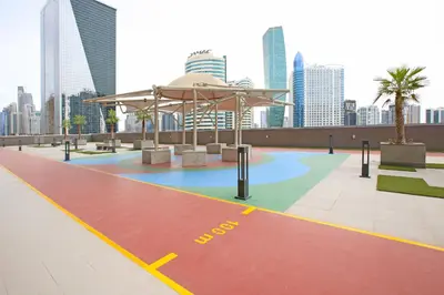 a pavilion in a city with buildings in the background at Studio Apartment featuring Alexa in Elite Residence - Allsopp & Allsopp in Dubai