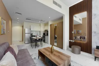 a living room with a couch and a table at Business Bay Gem , Burj Khalifa View in Dubai