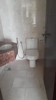 a bathroom with a toilet and a sink at 1BR Apt in Business bay close to canal and Dubai mall! in Dubai