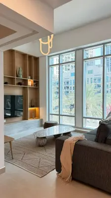 a living room with a couch and a table at DAYF-LFT 2 BR in the heart of Downtown walking distance to Burj Khalifa Park in Dubai
