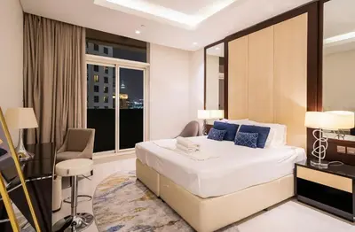 a hotel room with a bed and a window at Luxury 3BR Burj Khalifa View Infinity Pool Spa Gym in Dubai