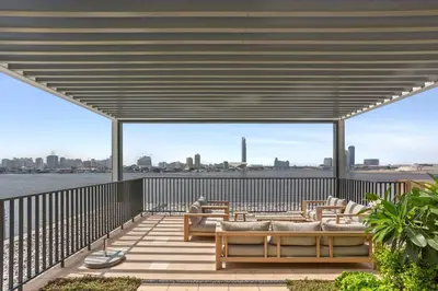 a patio with couches and a view of the city at Stunning 1BDR with Resort Style in Creek Harbour in Dubai