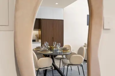 a dining room with a table and chairs at Stunning 1BDR with Resort Style in Creek Harbour in Dubai