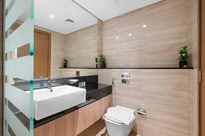 a bathroom with a sink and a toilet at ALiving Elegant 1BR I Near Burj Khalifa & Dubai Mall I Missoni Tower- 607 in Dubai