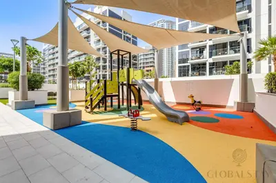 a playground with a slide in a building at GLOBALSTAY Azizi Riviera 45 in Dubai