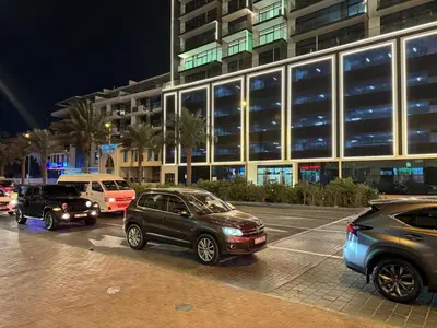 a group of cars parked in front of a building at Jumeirah Heights in Dubai
