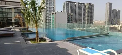 a large swimming pool on top of a building at Jumeirah Heights in Dubai