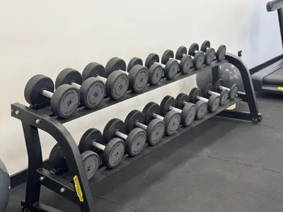a row of dumbbells on a rack in a gym at Jumeirah Heights in Dubai