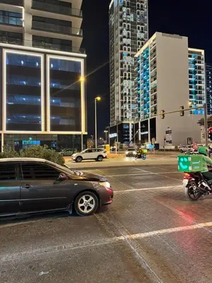 a car parked in a parking lot at night at Jumeirah Heights in Dubai