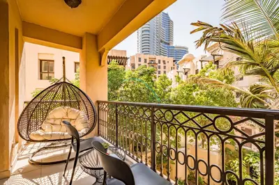 a balcony with chairs and a swing at Appealing 1BR Apartment at Miska 2 Old Town, Downtown Dubai by Deluxe Holiday Homes in Dubai